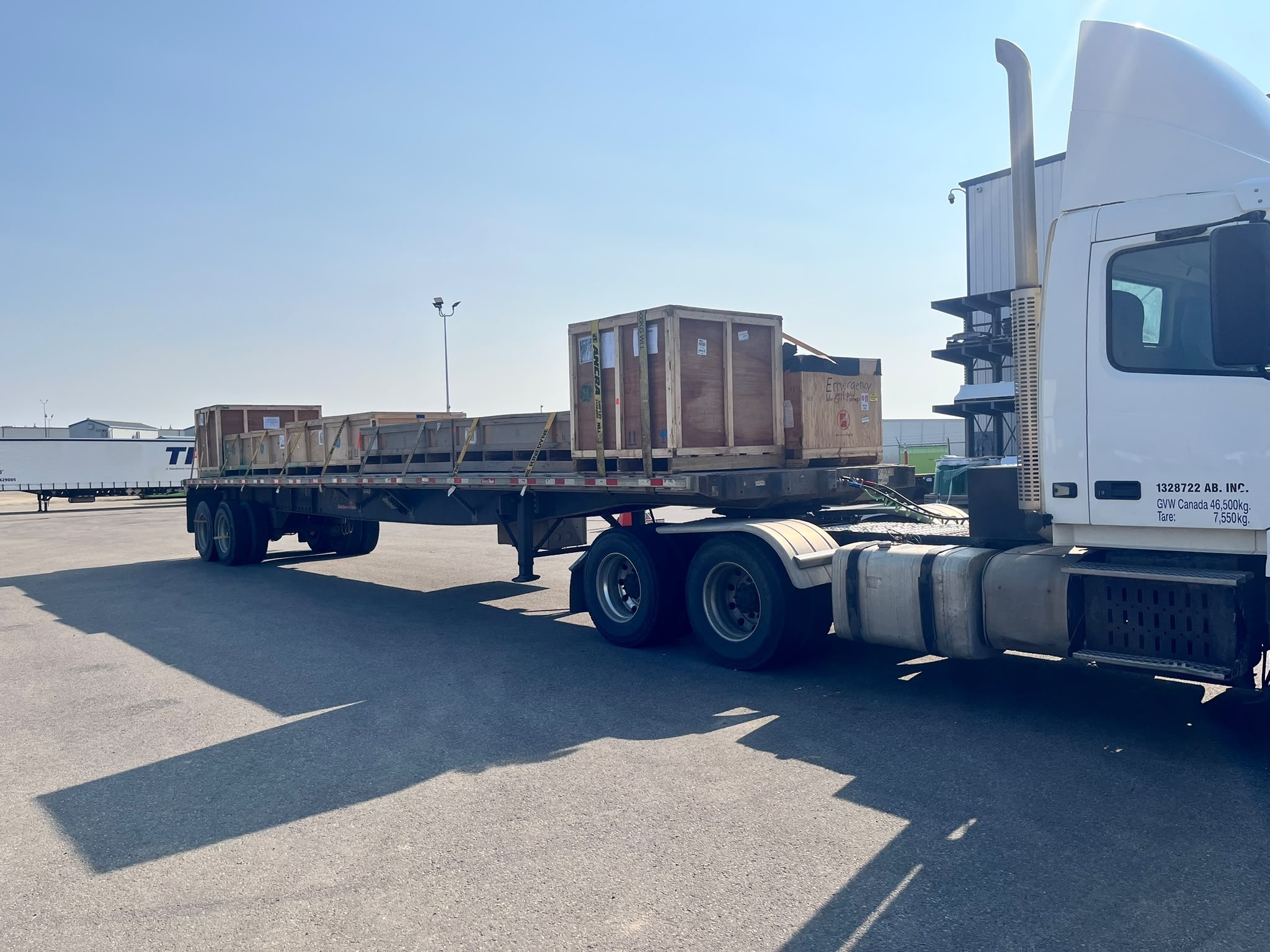 Kandys Express flat deck loaded with crated freight, ready for dispatch
