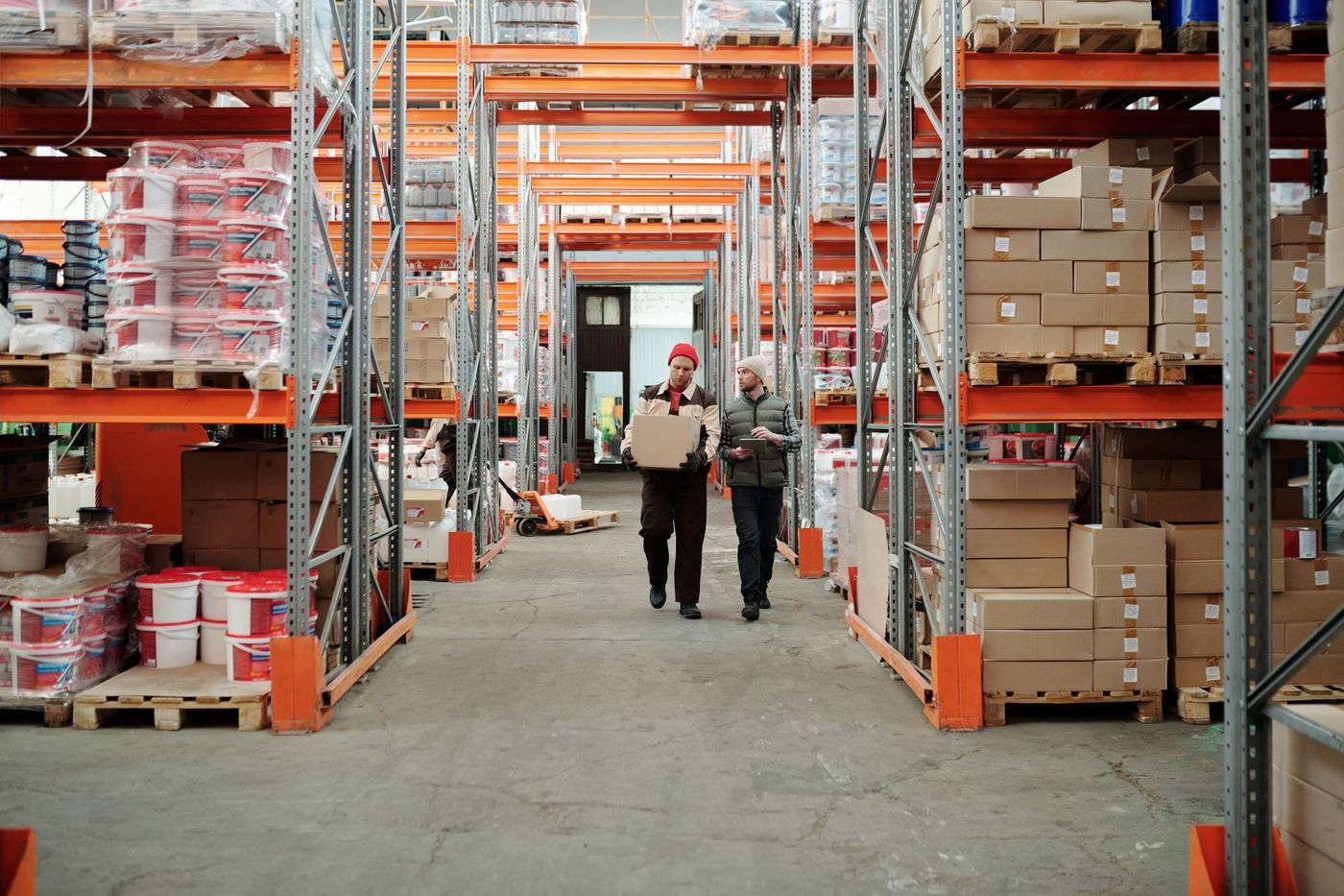 Warehouse crew moving palletized freight